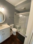 Full Bathroom at Bottom of Stairs from Twin Bedroom Next to Kitchen 